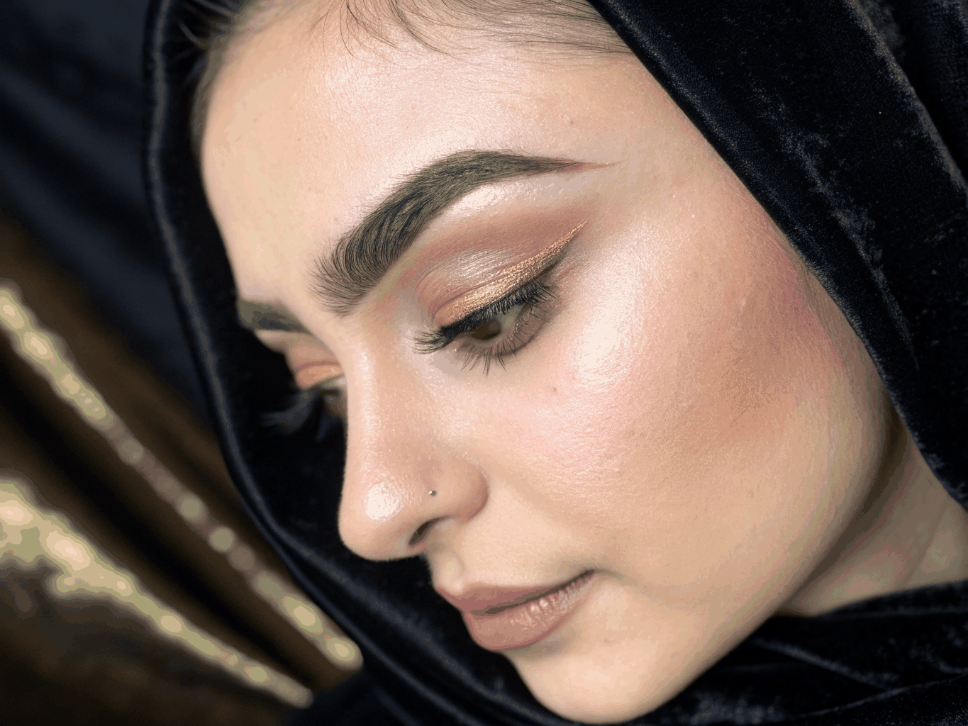 Close-up of styled brow lamination and tint finish on a dark-skinned Black Nigerian student's face